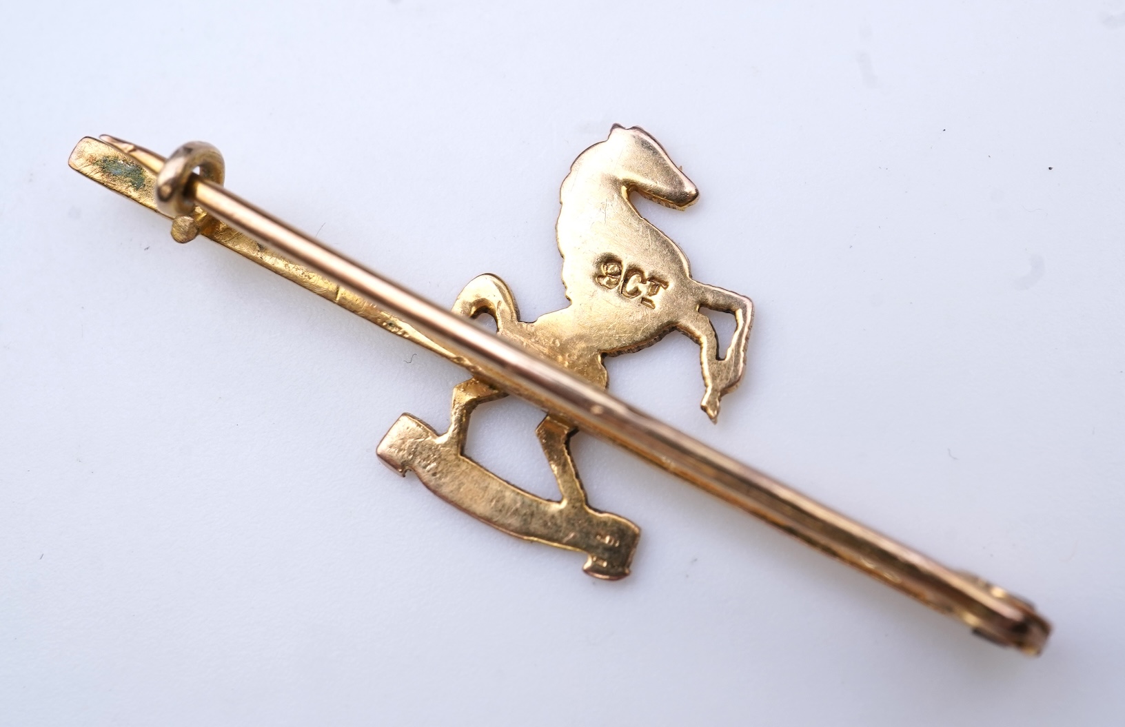 Four brooches and a gold signet ring